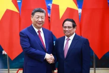越南政府总理范明正会见中共中央总书记、中国国家主席习近平。