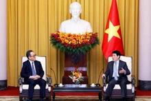 越南国家主席梁强会见韩国外交部长赵兑烈。
