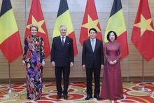 越南国家主席梁强及夫人与比利时国王菲利普及夫人出席招待会。（图片来源：越通社）