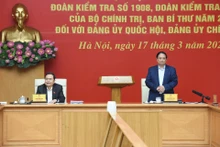 越南政府总理范明正与国会主席陈青敏主持检查团报告草案审议会议[组图]