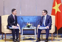 范明正总理会见金务大置地集团（Gamuda Land）董事长拿督周志华。（图片来源：越通社）