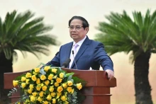 会议上，范明正总理指出了越南汇聚建立国际金融中心的5个条件。（青江 摄）