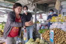 芹苴市有了首个无现金农贸市场。