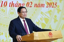 政府总理范明正在会上发表讲话。（图片来源：越通社）