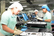 坐落在河内市升龙工业区的越南佳能有限责任公司的电子产品生产。（登英 摄）