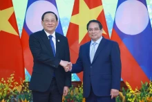 越南政府总理范明正与老挝政府总理宋赛·西潘敦。