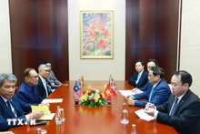 范明正总理会见安瓦尔·易卜拉欣总理。（图片来源：越通社）