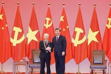 越南共产党中央委员会总书记阮富仲与中国共产党中央委员会总书记、中华人民共和国主席习近平。（图片来源：越通社）