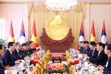 越南国家主席武文赏与老挝人民革命党中央委员会总书记、老挝国家主席通伦·西苏里举行会谈。(图片来源:越通社)