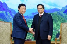 越南政府总理范明正会见国际粮农组织总干事屈冬玉。