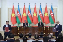 苏林总书记与阿塞拜疆总统见证越南国家工业能源集团与阿塞拜疆经济部关于石油勘探开采、石油技术服务和培训领域合作谅解备忘录换文仪式。（图片来源：越通社）