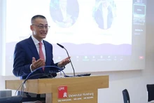 武光明大使在研讨会上发言。（图片来源：越通社）