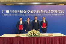河内与广州加强交流合作备忘录签署仪式。（图片来源：越通社）