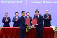 关于建立“越中大学网络”的谅解备忘录换文仪式。（图片来源：越通社）