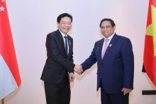 越南政府总理范明正和新加坡总理黄循财。（图片来源：baochinhphu.vn）