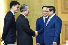 越南政府总理范明正会见中国驻越南大使熊波。（图片来源：dangcongsan.vn）