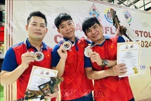 越南射击运动员何明成、潘春专何武进南。