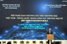 越南贸易促进局副局长黄明战在会议开幕式上致辞。