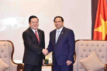 范明正总理会见东盟秘书长高金洪