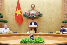 范明正总理发表总结讲话。（图片来源：越通社）