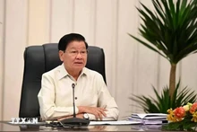 老挝人民革命党中央总书记、老挝国家主席通伦·西苏里在纪念活动上致辞。（图片来源：越通社）
