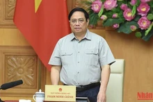 范明正总理就应对第四号台风召开紧急会议。（图片来源：陈海 摄）