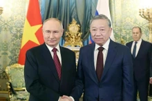 越共中央总书记苏林与俄罗斯总统普京。（图片来源：越通社）