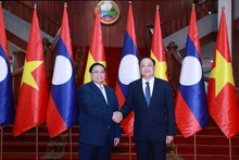 越南政府总理范明正与老挝政府总理宋赛·西潘敦。