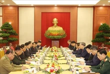 越南共产党代表团与老挝人民革命党代表团会面场景。