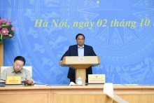 越南政府总理范明正在会议上发言。（陈海 摄）