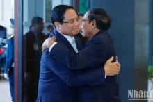 越南政府总理范明正与老挝国家副主席。