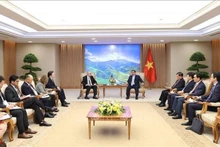 政府总理范明正会见美国—东盟商业委员会和美国企业代表。（图片来源：越通社）