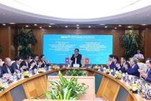 老挝人民革命党中央检查委员会高级代表团造访越南投资发展股份商业银行。