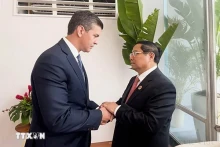 2024年11月，赴巴西里约热内卢出席二十国集团领导人峰会的越南政府总理范明正会见巴拉圭总统圣地亚哥·培尼亚。（图片来源：越通社）