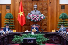 范明正总理主持会议。（图片来源：VGP）