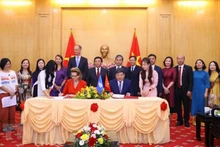 签署仪式场景。（图片来源：越通社）