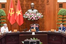 越南政府总理范明正主持有关越南进出口商品税收解决方案的会议【组图】