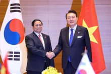 越南政府总理范明正和韩国总统尹锡悦。