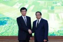 越南政府总理范明正会见中国政协主席王沪宁。