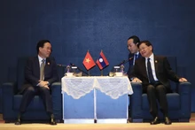 越南国家主席武文赏会见老挝人民革命党中央总书记、老挝国家主席通伦·西苏里。(图片来源:越通社)
