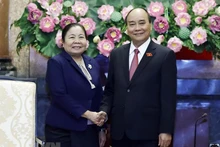 越南国家主席阮春福和老挝人民革命党中央组织部部长西赛•乐迪蒙颂。（图片来源：越通社）