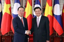 越南国家主席武文赏与老挝人民革命党中央委员会总书记、老挝人民民主共和国主席通伦·西苏里。