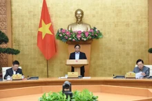 越南政府总理范明正主持召开评估地区和世界经济局势的政府会议【组图】