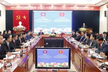 越共中央民运部和老挝建国阵线中央委员会群众工作经验交流会暨培训班开班仪式。