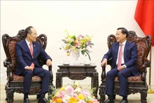 越南政府副总理黎明慨会见韩国副总理兼财政经济部部长秋庆镐。