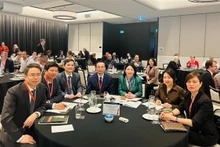 出席2023年IMPACT会议的越南代表。