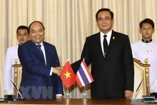 资料图：越南国家主席阮春福和泰国总理巴育。（图片来源：越通社）