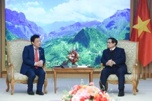 越南政府总理范明正会见联合国粮农组织总干事屈冬玉【组图】