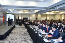 越南国家主席武文赏出席越南与美国企业与地方圆桌座谈会。