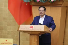 越南政府总理范明正发表讲话。（图片来源：VGP）